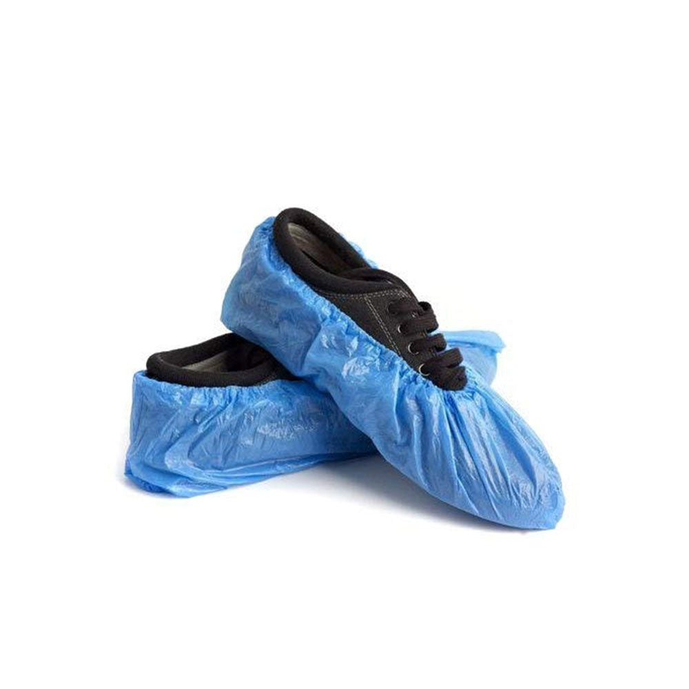 Nylon Blue shoe covers over black shoes on a white background