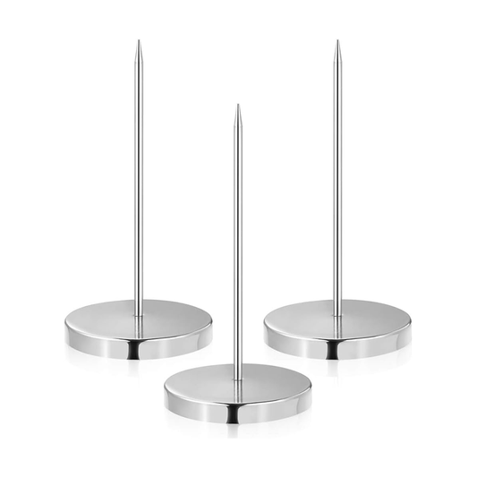 Three chrome candle holders on a white background