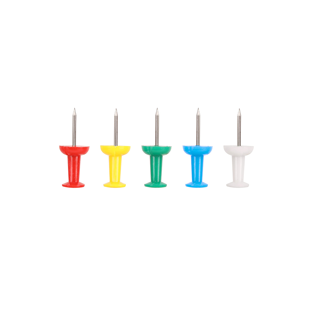 Set of five colorful push pins on a white background