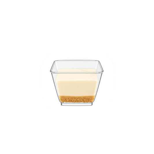Clear glass dessert dish with a layered dessert on a white background